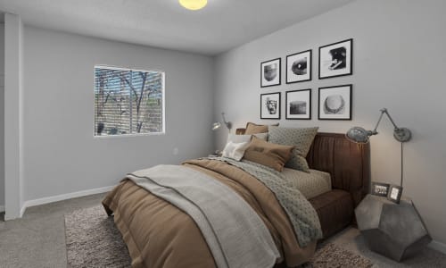 An apartment bedroom with an attached bathroom at Pine Crest Apartment Homes in North Augusta, South Carolina