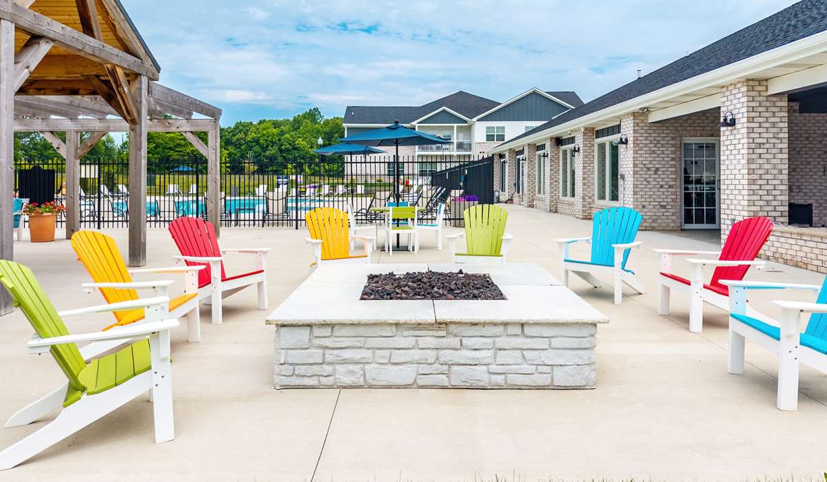 Community firepit area with seating at Union Club Apartments in Fort Wayne, Indiana