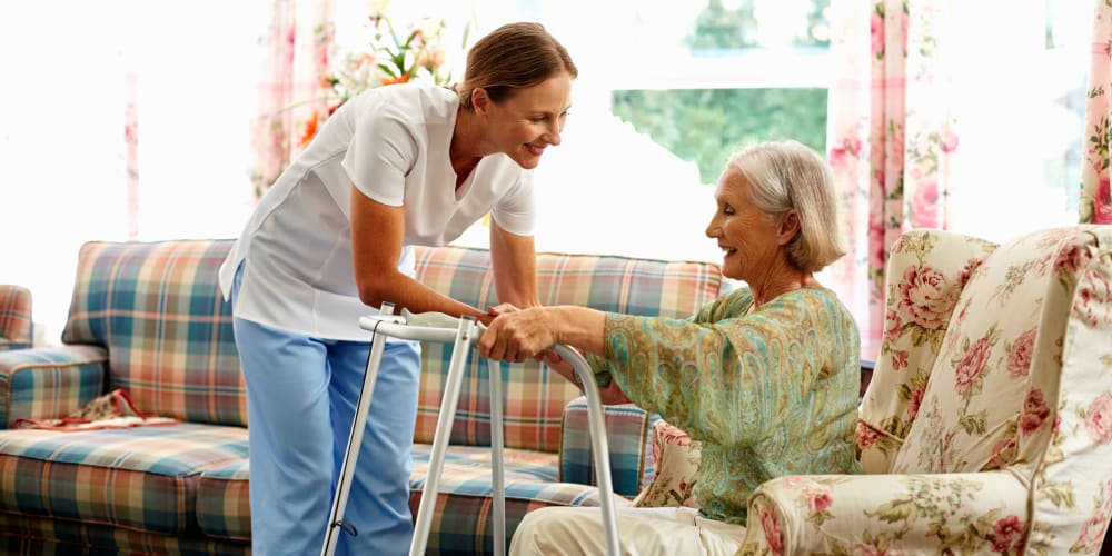 A staff member helping a resident at Careage in Gig Harbor, Washington. 