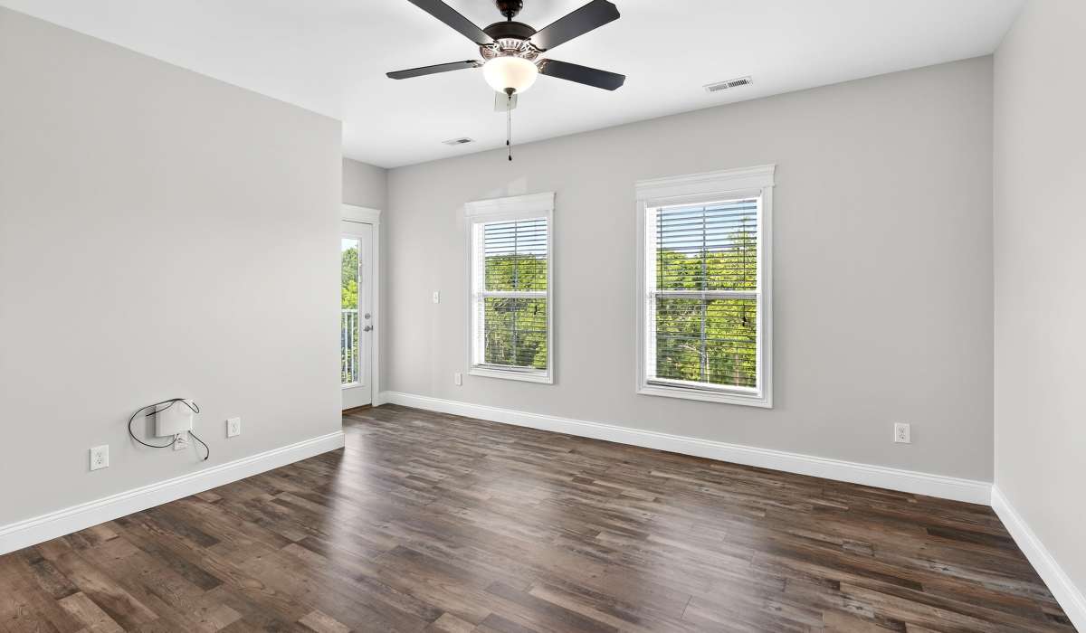 Unfurnished living room with ceiling fan and window at Palomar Woods in Lexington, Kentucky