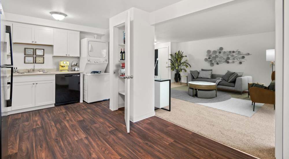 Kitchen and living room of an open floor plan model apartment home at Bluffs at Evergreen in Everett, Washington