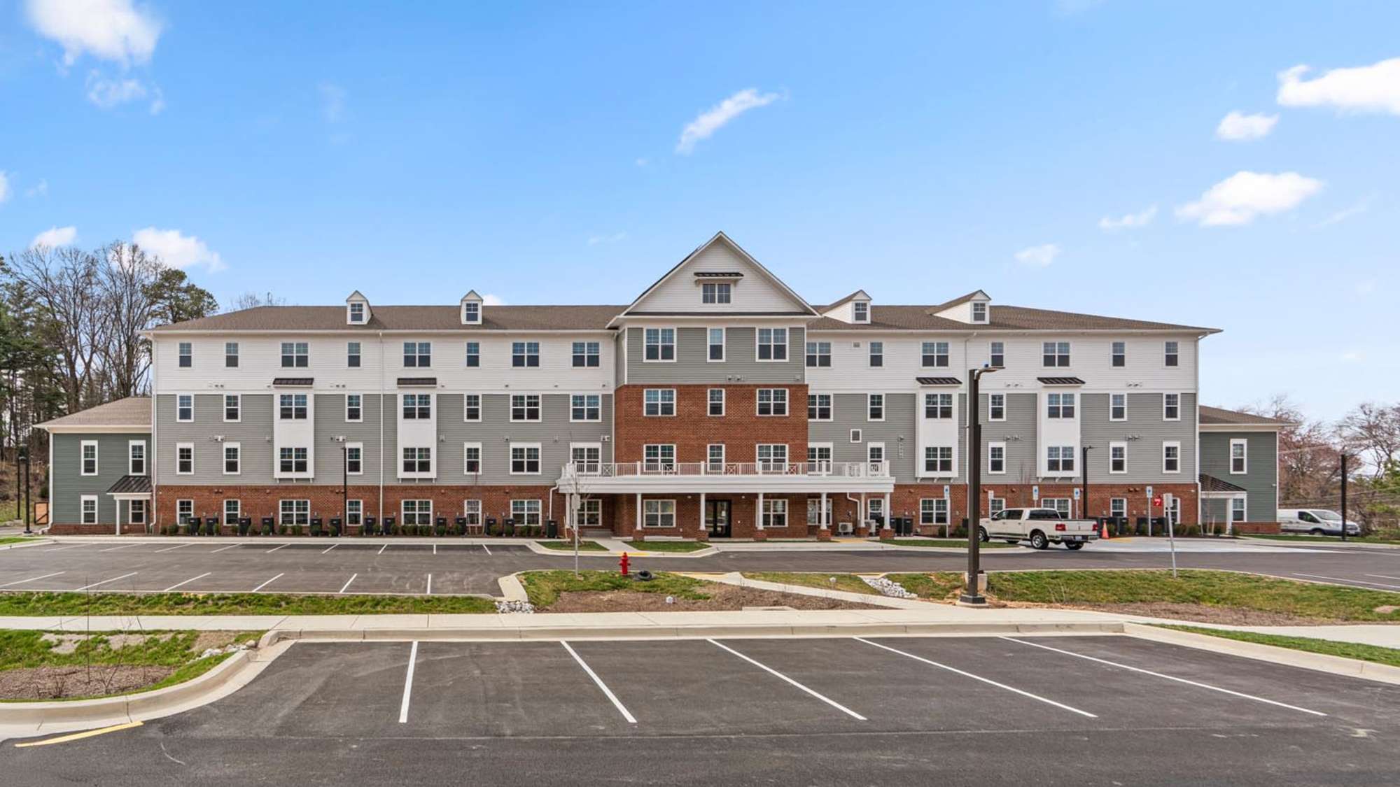 Parking lot with view of building Millersview Crossing in Millersville, Maryland