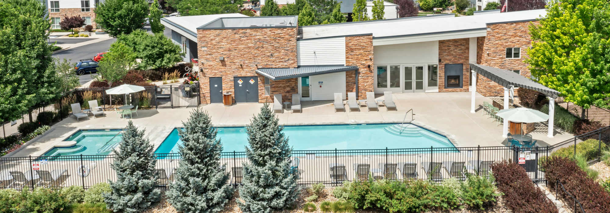Swimming pool with laid back chairs at VerraWest in Longmont, Colorado