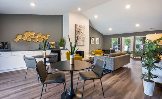 Contemporary clubhouse with plenty of seating at Sharon Pointe Apartment Homes in Charlotte, North Carolina