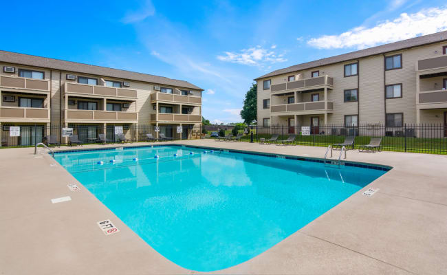 Swimming pool with an expansive sundeck at Gable Oaks Apartment Homes in Rock Hill, South Carolina