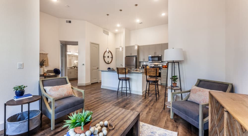 Spacious model apartment with wood-style flooring at Luxia Craig Ranch, Mckinney, Texas