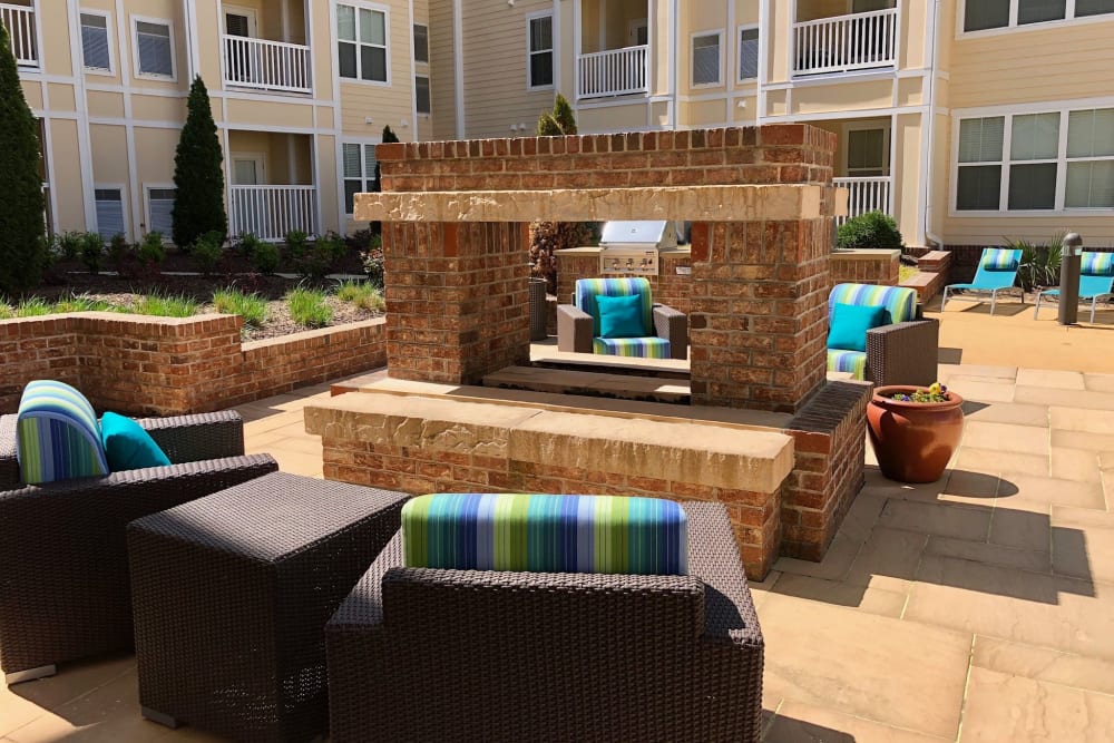 Outdoor lounge chairs by fire at Level at 401 in Raleigh, North Carolina