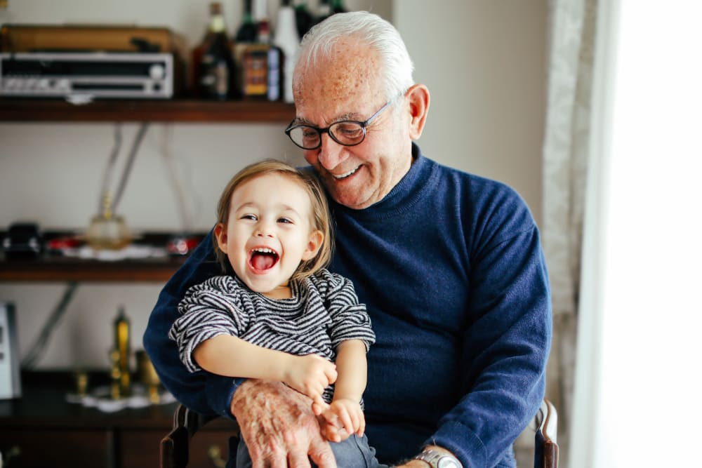 Resident visiting with grandchild at Carolina Gardens at York in York, South Carolina