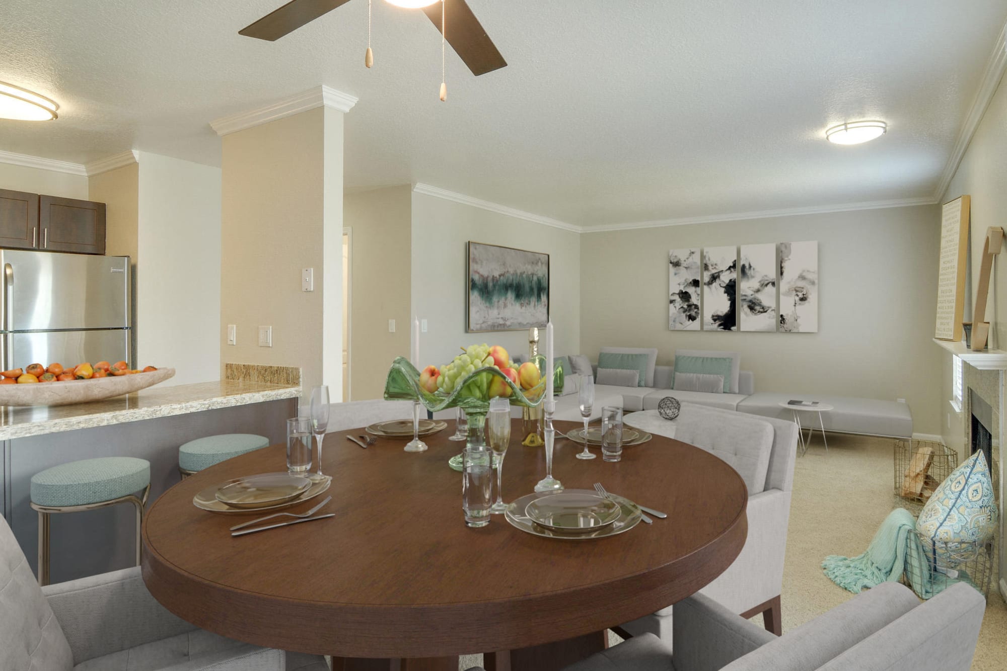 Dining room looking into the kitchen and living room at Carriage House Apartments in Vancouver, Washington