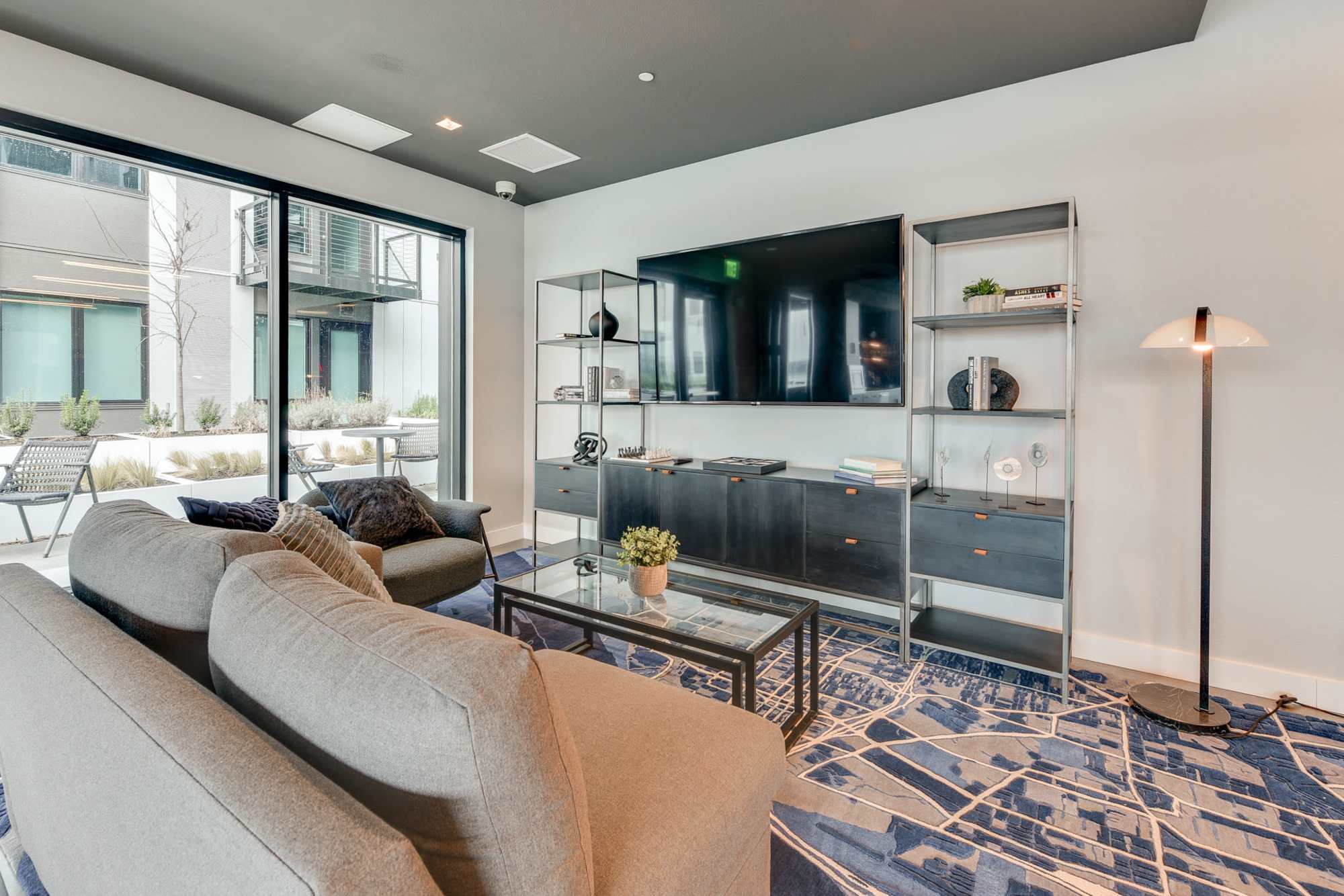 Clubhouse with lounge seating and television at The Columbia at the Waterfront in Vancouver, Washington