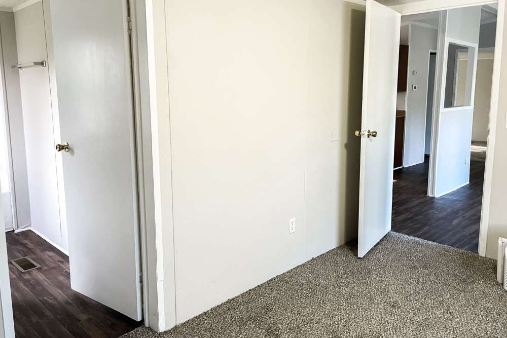 Apartment with plush carpeting at Fairview Crossing in Scottsburg, Indiana