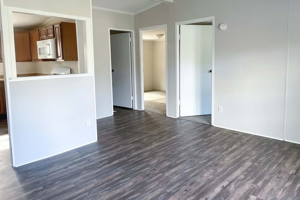 Modern apartment with wood style flooring at Fairview Crossing in Scottsburg, Indiana