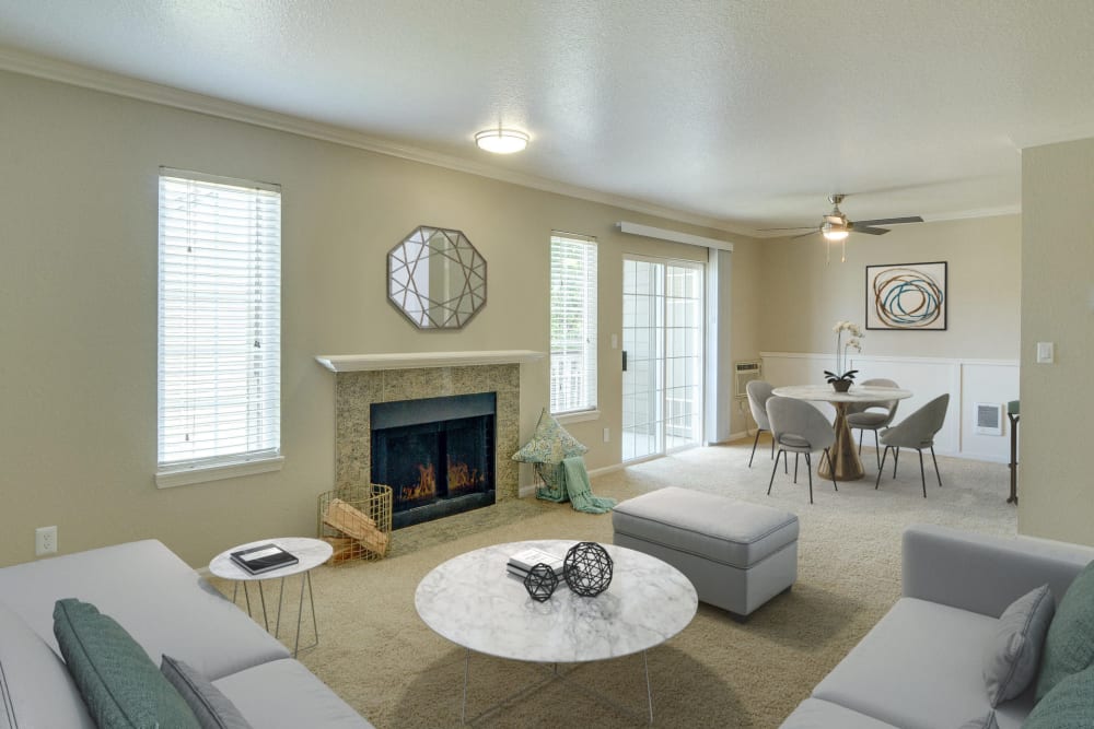 Fireplace and patio access in a living room at Carriage House Apartments in Vancouver, Washington