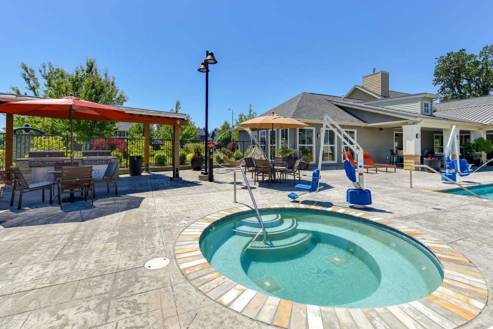 Swimming pool with in-pool loungers at Terrene at the Grove in Wilsonville, Oregon