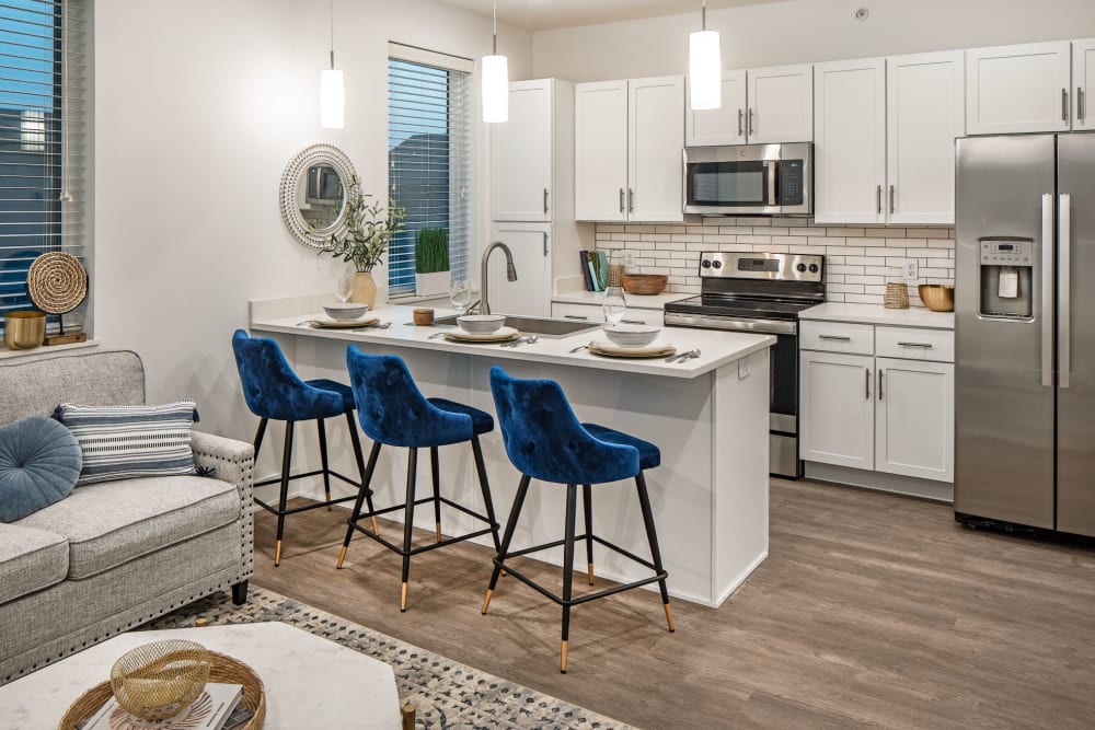 A living room with a open kitchen at Ravello 192 in Elkhorn, Nebraska