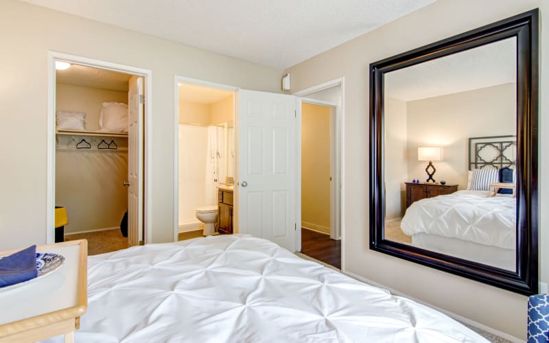 A master bedroom looking into the attached bathroom at Lakeview Village Apartments in Spring Valley, California