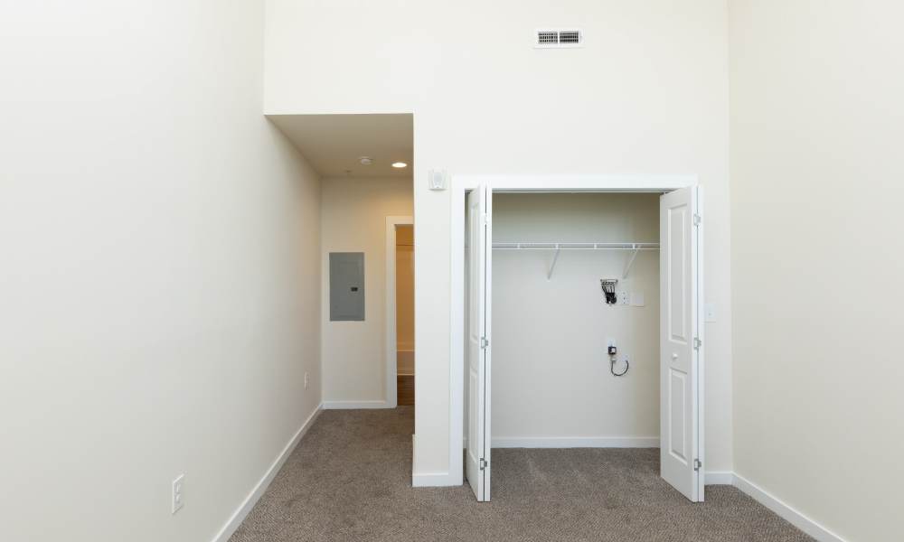 Bedroom with spacious walk-in closets at Lofts at Inman Mills in Inman, South Carolina