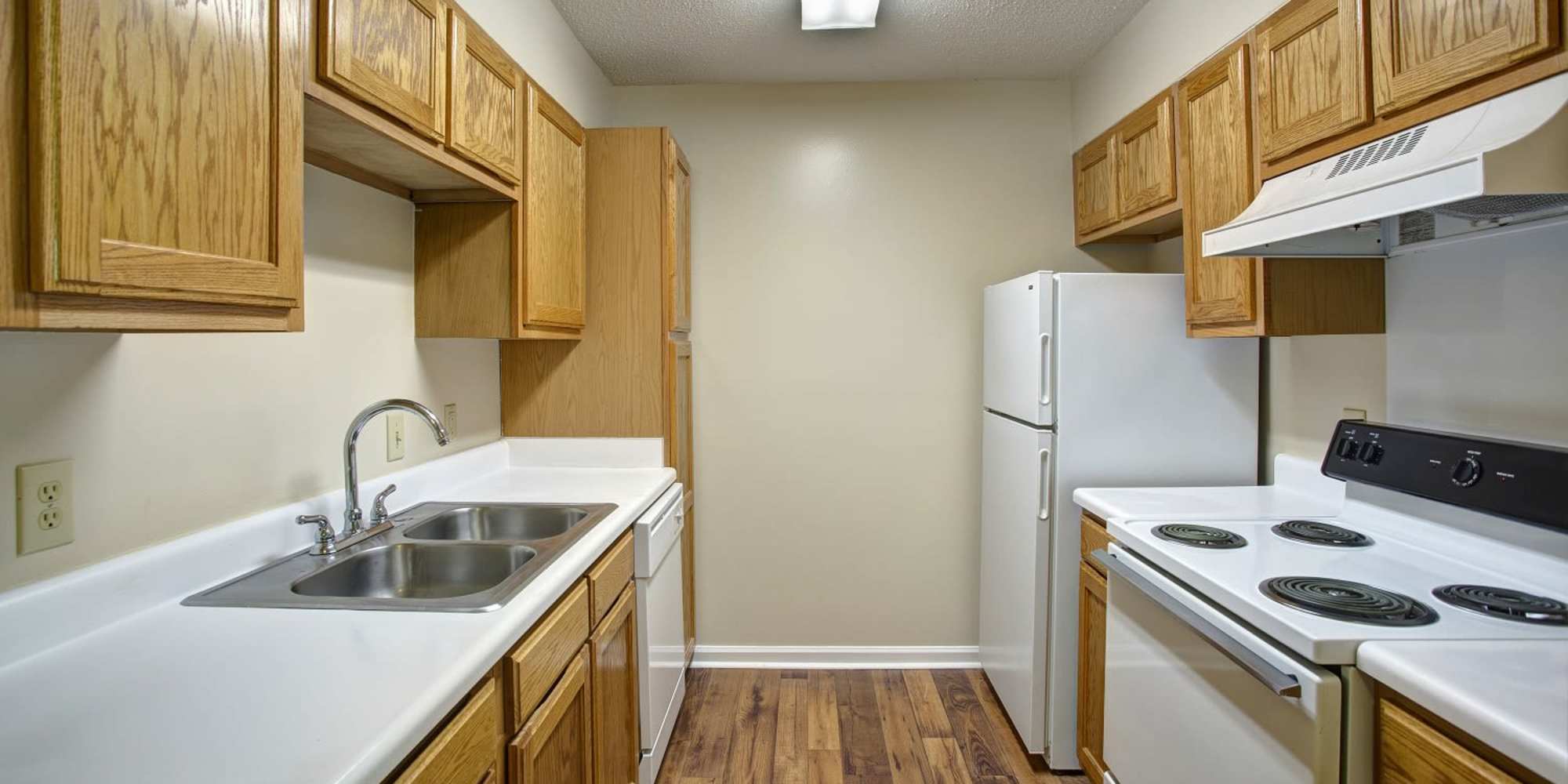 Kitchen with white appliances at Ridgewood at Greenbrier in Greenbrier, Tennessee