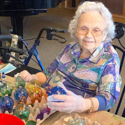 Resident decorating baubles at Canoe Brook Assisted Living in Ardmore, Oklahoma