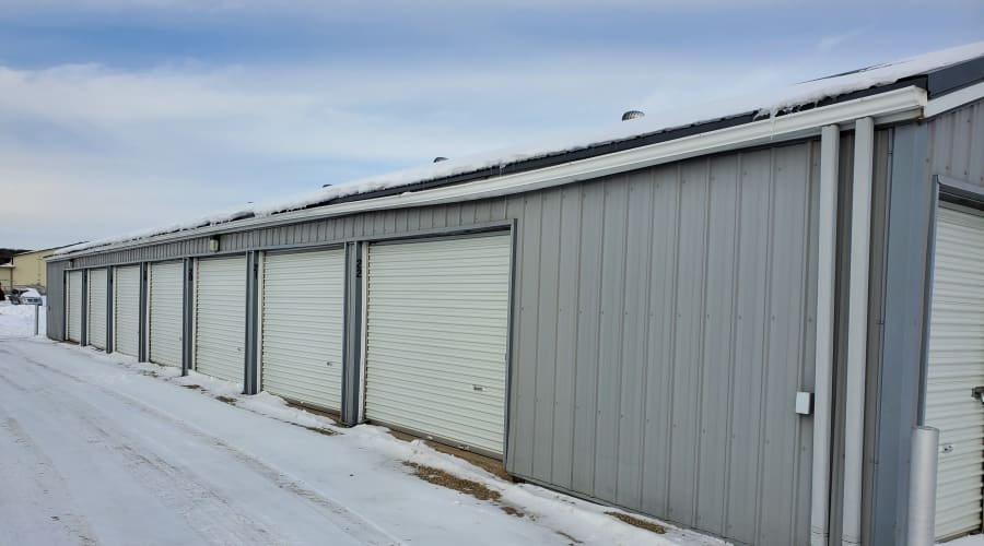 Outdoor storage units with white doors at KO Storage of Waseca 5th St in Waseca, Minnesota