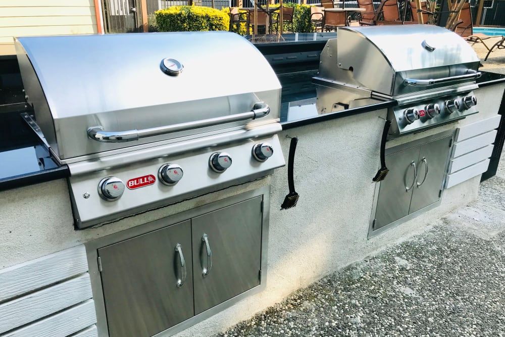 Outdoor barbecues near the pool at Bennington Apartments in Fairfield, California