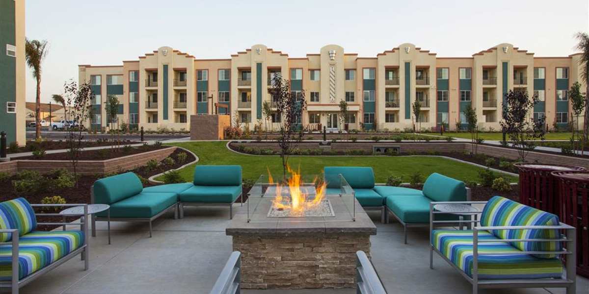 Apartment exterior with fireplace at Hancock Terrace in Santa Maria, California