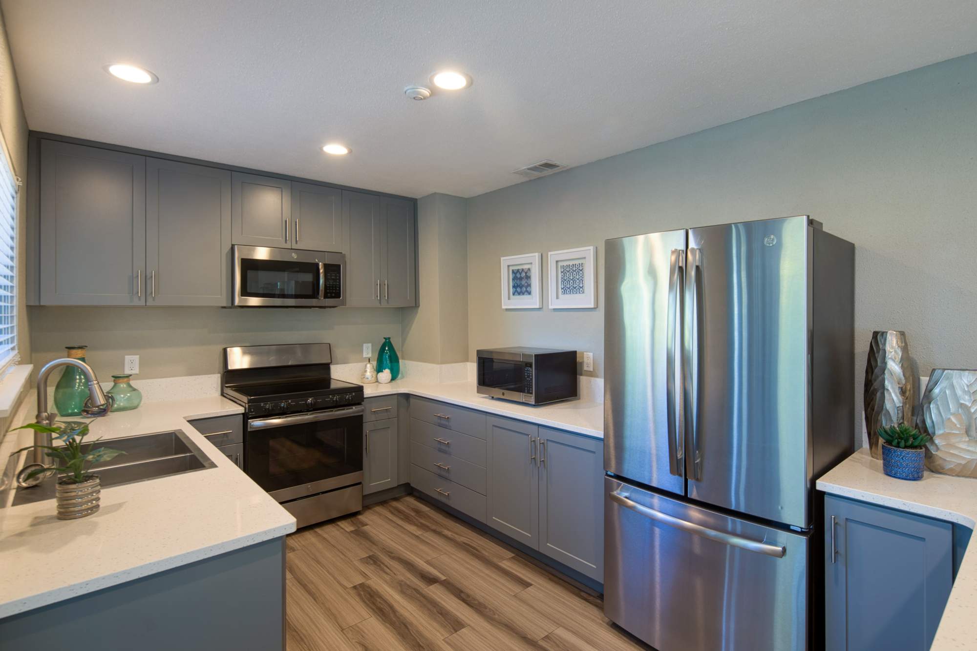 Community kitchen with stainless-steel appliances at Falls at Arden in Sacramento, California