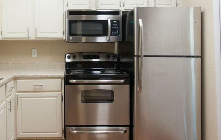 Stainless-steel appliances in kitchen at The Regent in Dallas, Texas