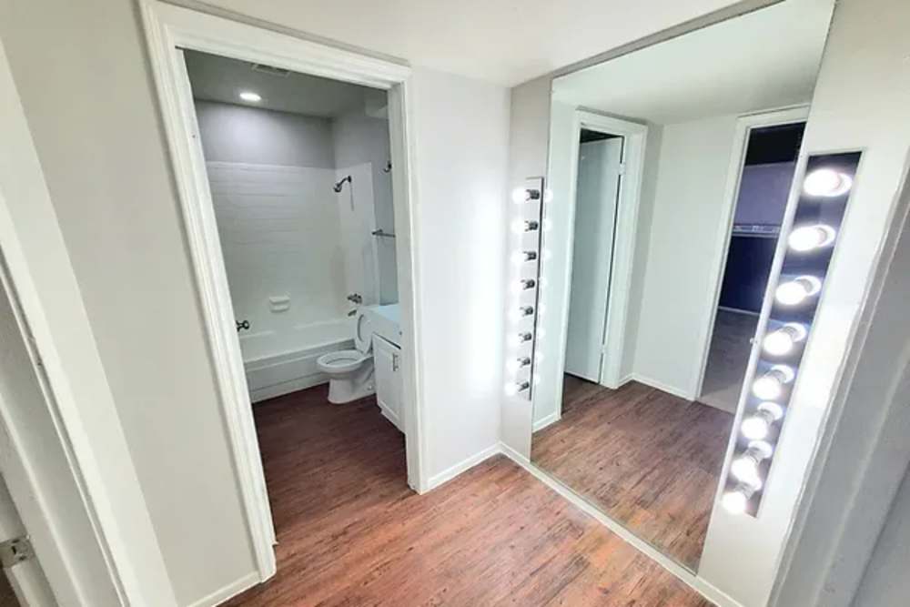 Closet vanity adjacent to bathroom at Arcos in San Antonio, Texas