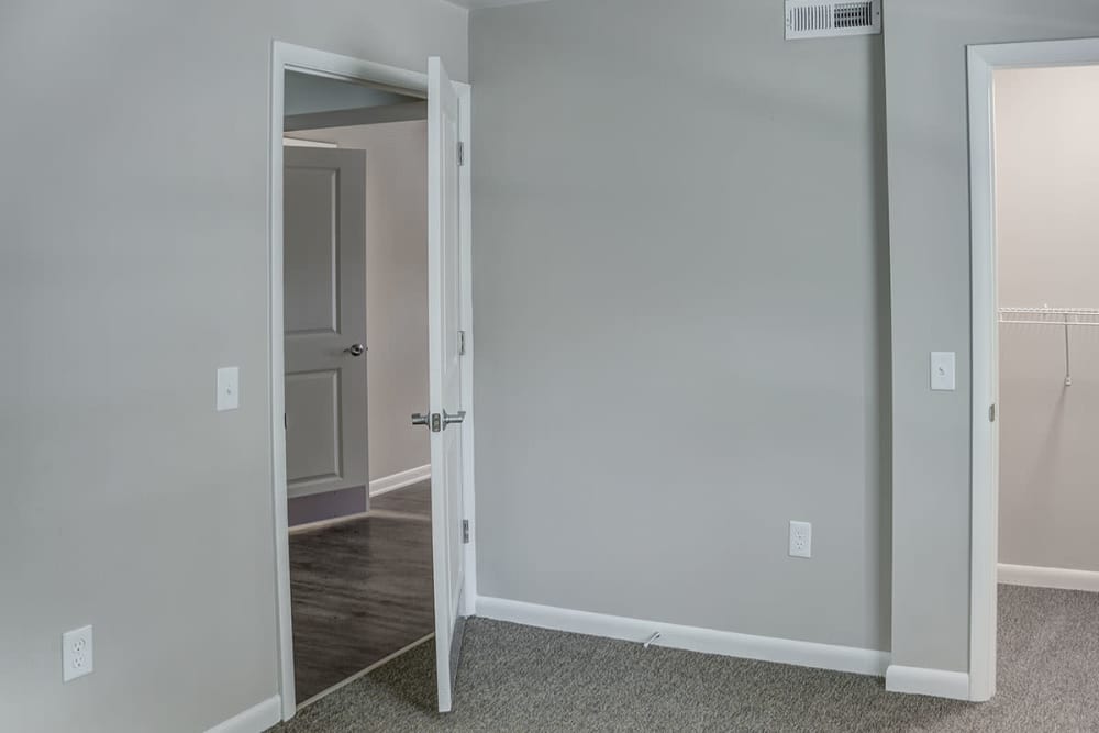 Carpet floored bedroom at Bell Diamond Manor in Norfolk, Virginia