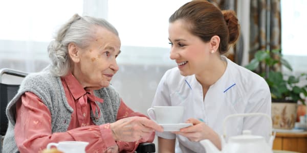 Nurse making a cup of tea for a resident at Holton Manor in Elkhorn, Wisconsin