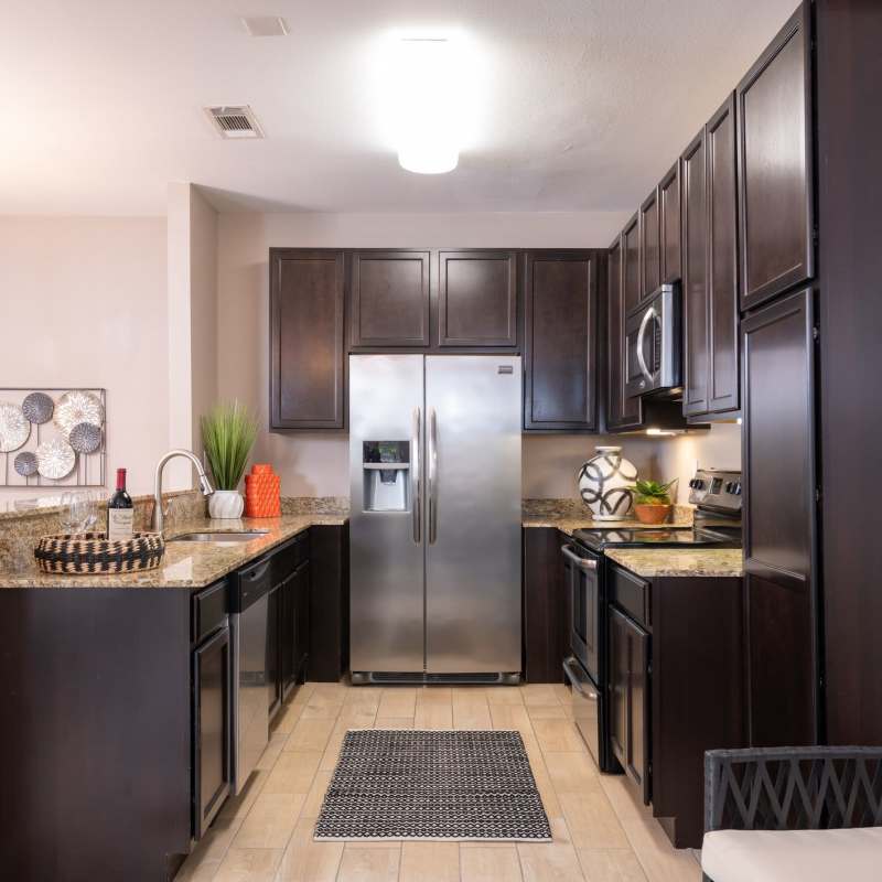 Apartment kitchen with modern appliances at The Quorum At Trophy Club in Trophy Club, Texas