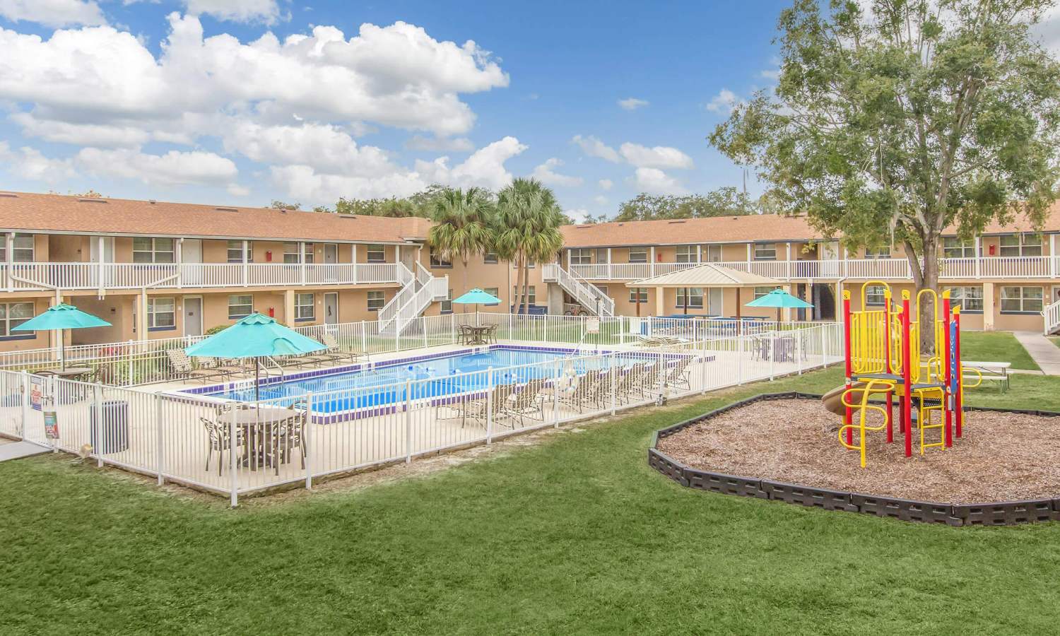 Seating near pool at Serenity Apartments in Leesburg, Florida