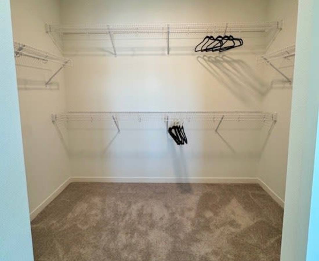 Empty closet with wire shelves and hangers at Pritchard Park Place in Racine, Wisconsin