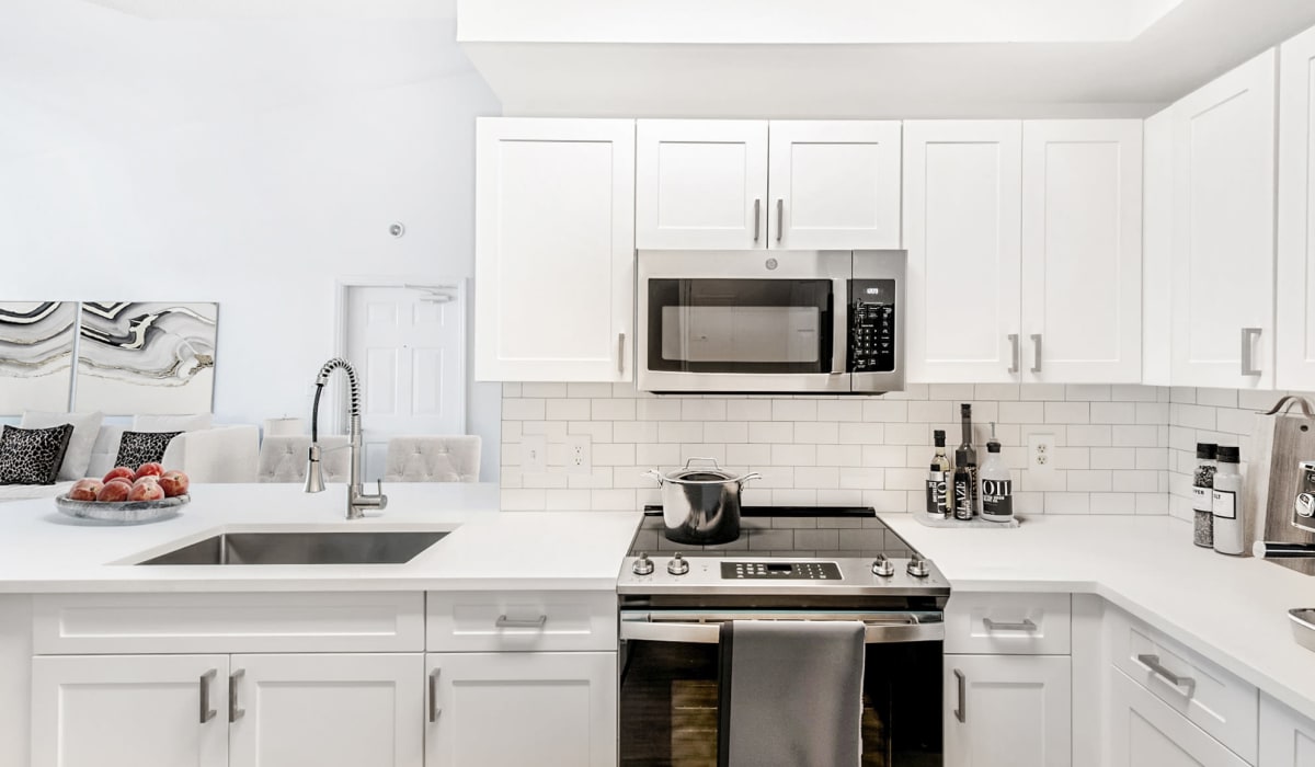 Kitchen with modern appliances at The Estates at Wellington Green Apartments, Wellington, Florida