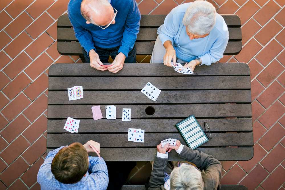 Residents playing cards at  The Villas at Stanford Ranch in Rocklin, California