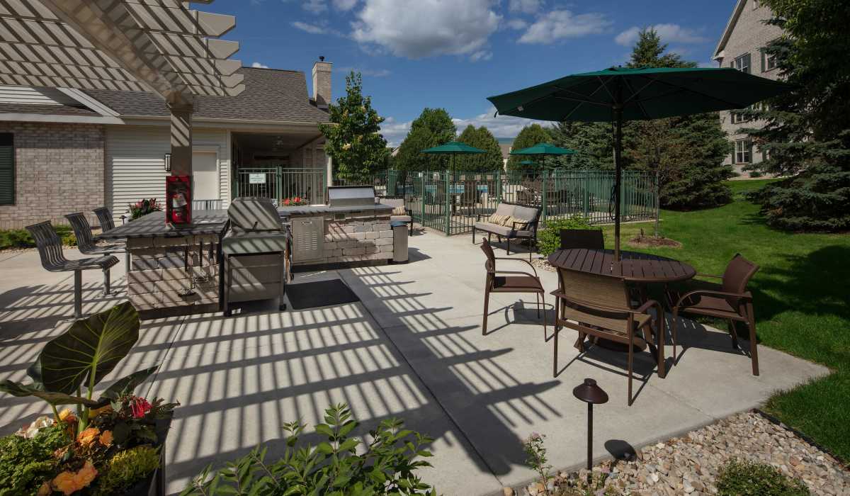 Outdoor grilling station with lots of seating area at Quail Run in Middleton, Wisconsin