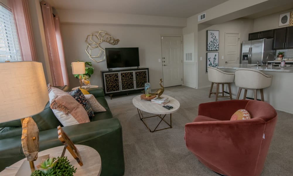 Model living room with open floor plan at Redbud Ranch Apartments in Broken Arrow, Oklahoma