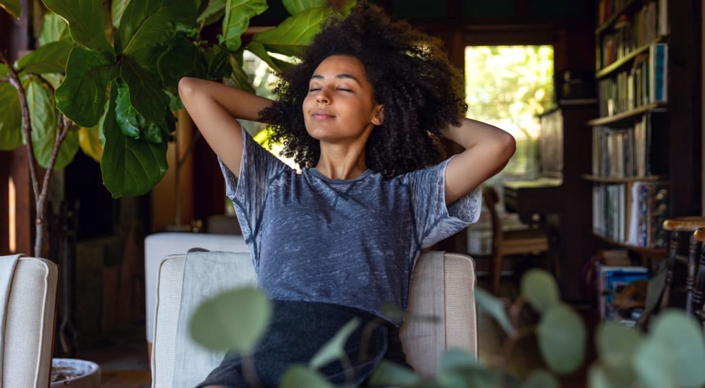 A resident relaxes in her apartment at LaCabreah, Brownsburg, Indiana