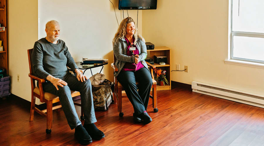 Two residents in a sitting room at 6th Ave Senior Living in Tacoma, Washington