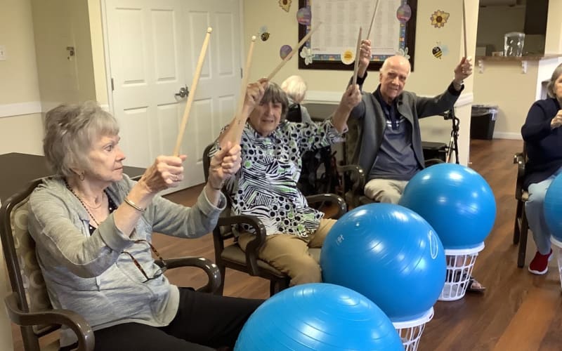Residents participating in a fun group activity at Grand Villa of Palm Coast in Palm Coast, Florida