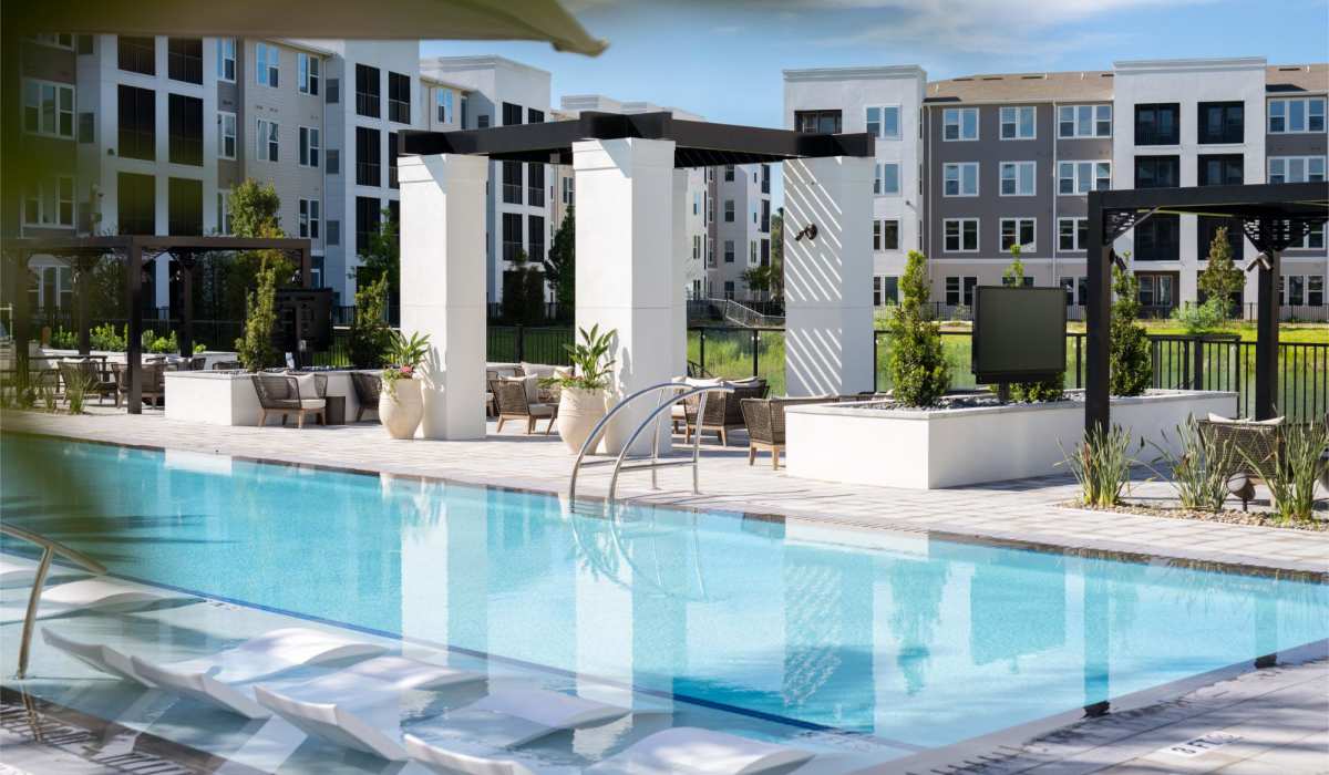 Pool with lounge chairs at Afton Palms in Sanford, Florida