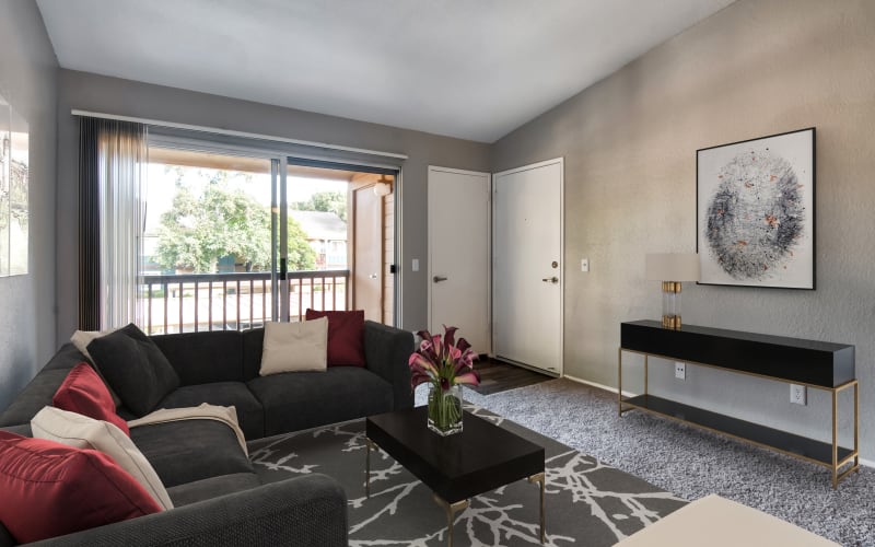 Spacious and bright living room with a private patio at Terra Nova Villas in Chula Vista, California