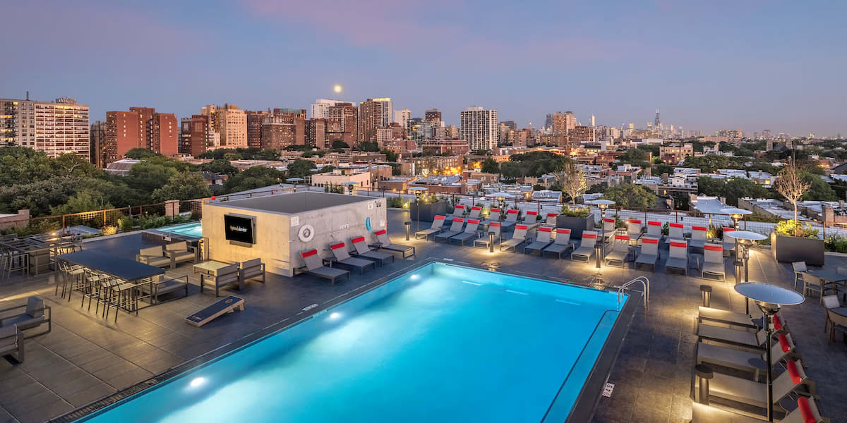 Pool night view of Optima Lakeview® a sister property of Optima Verdana® in Wilmette, Illinois