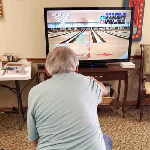 Resident playing wii bowling at Creekside Village in Ponca City, Oklahoma