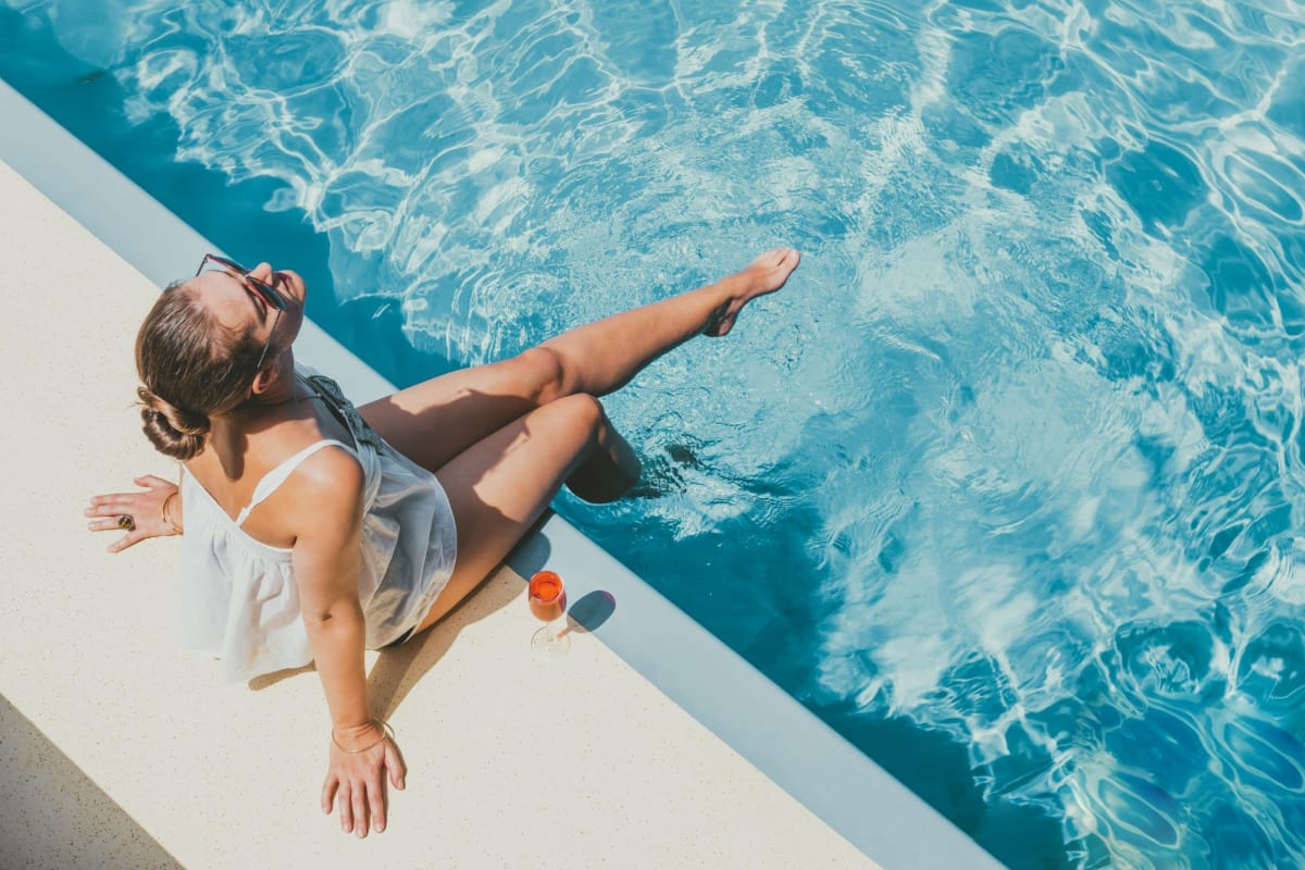 A resident sits poolside at Bay on 6th, Santa Monica, California