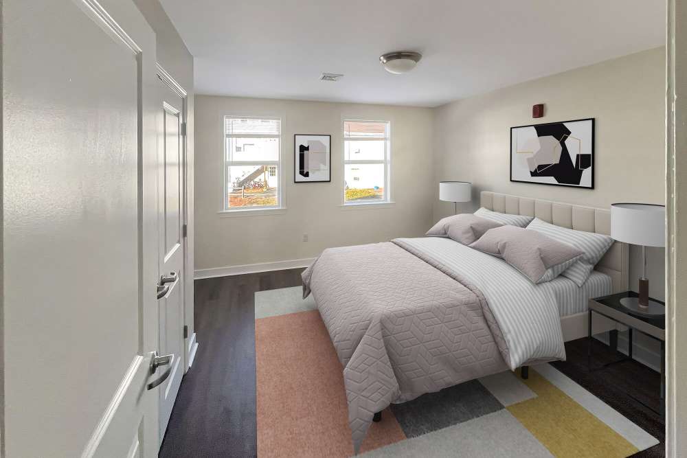 Comfortable bedroom with natural light at Stony Brook Village in Westford, Massachusetts