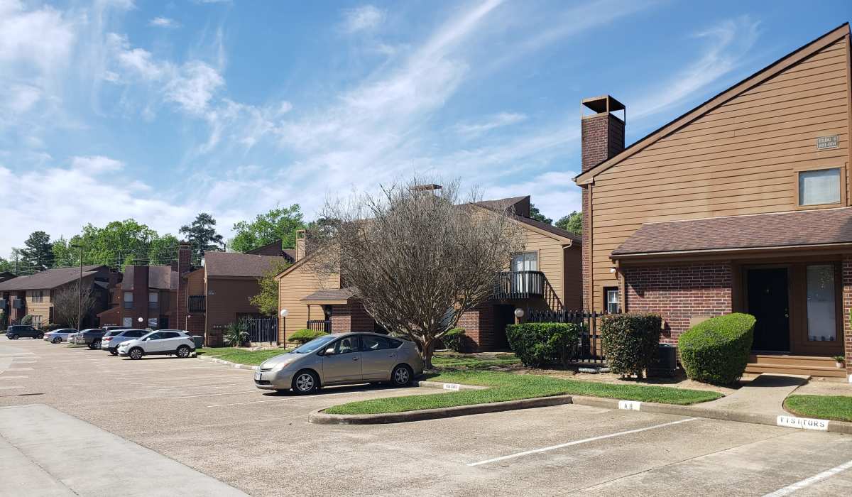 Community driveway view at Oaks of Kingwood Apartments in Kingwood, Texas