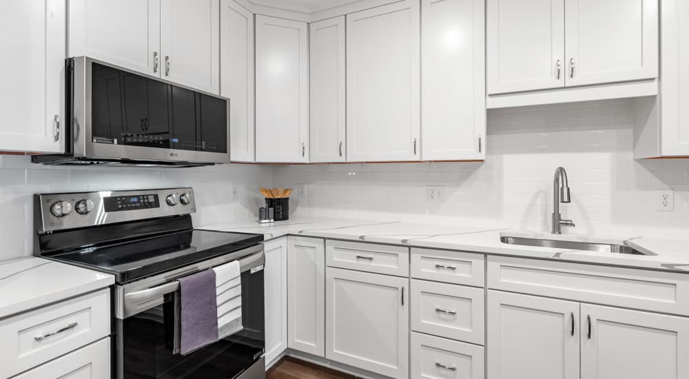 Kitchen with white cabinetries at Henrietta Place, Rochester, New York 