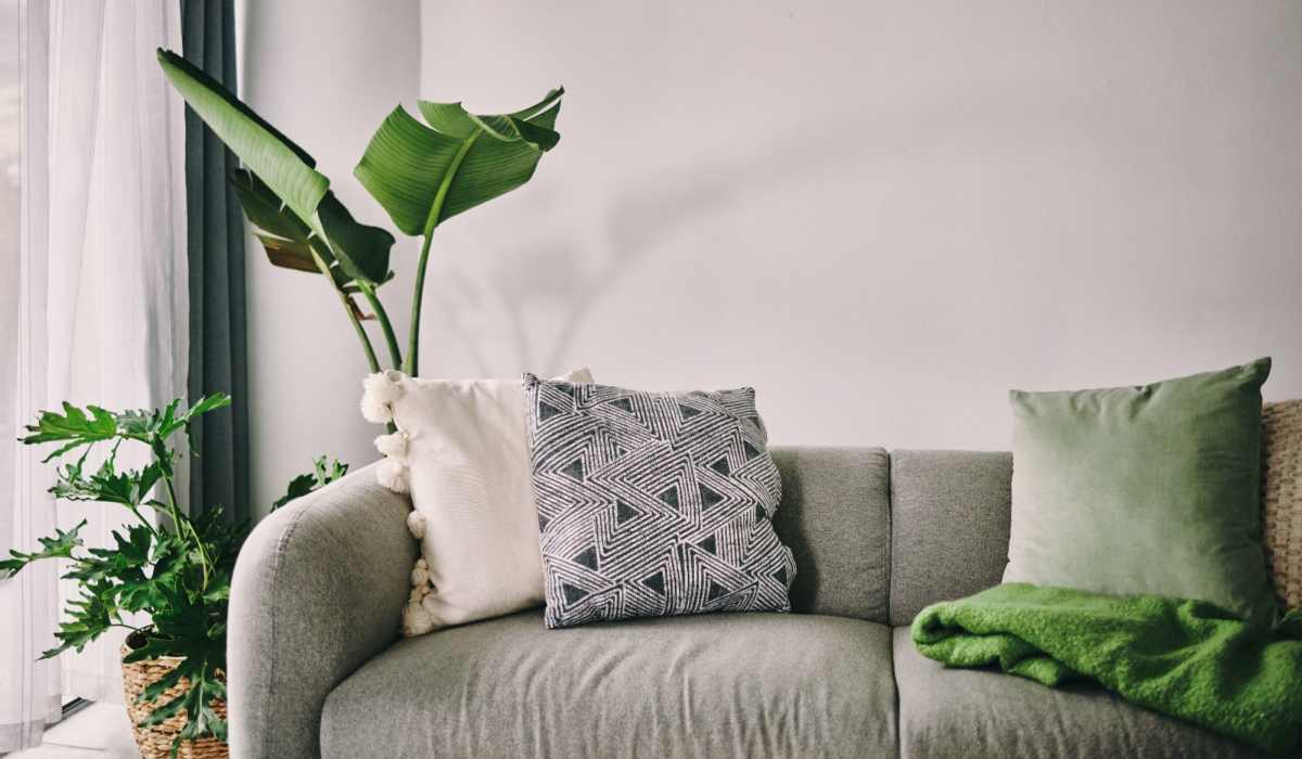 Couch with green accents and plants at Penn Square I in Baltimore, Maryland